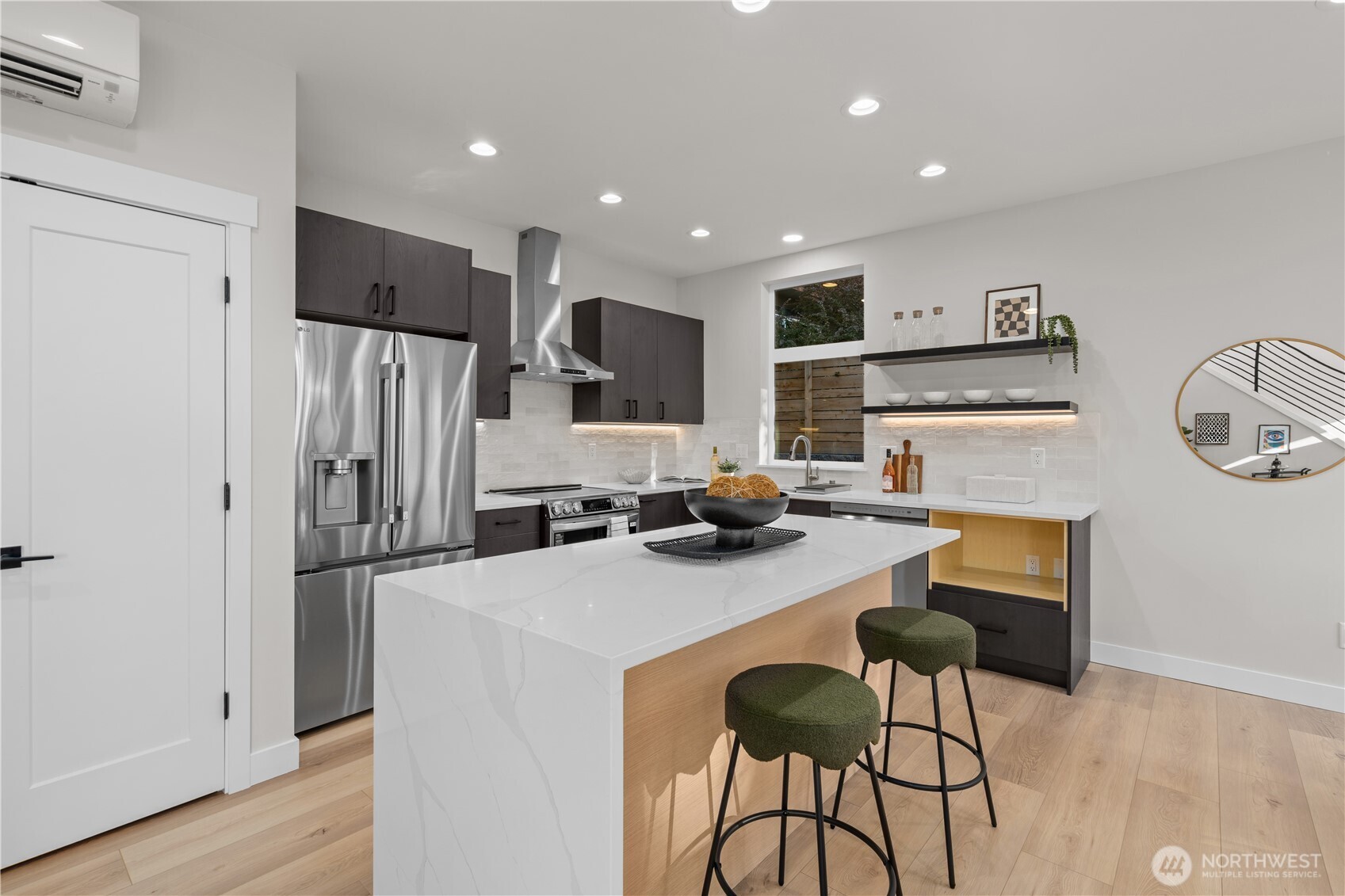 9230 22nd Avenue Southwest Seattle, WA 98106 - Photo 9 of 26 a kitchen with stainless steel appliances a refrigerator and a stove top oven