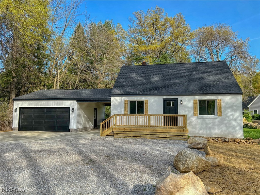 32155 Center Ridge Road North Ridgeville, OH 44039 - Photo 1 of 1 Cape cod house featuring a detached 2 car garage, driveway, deck, and front yard