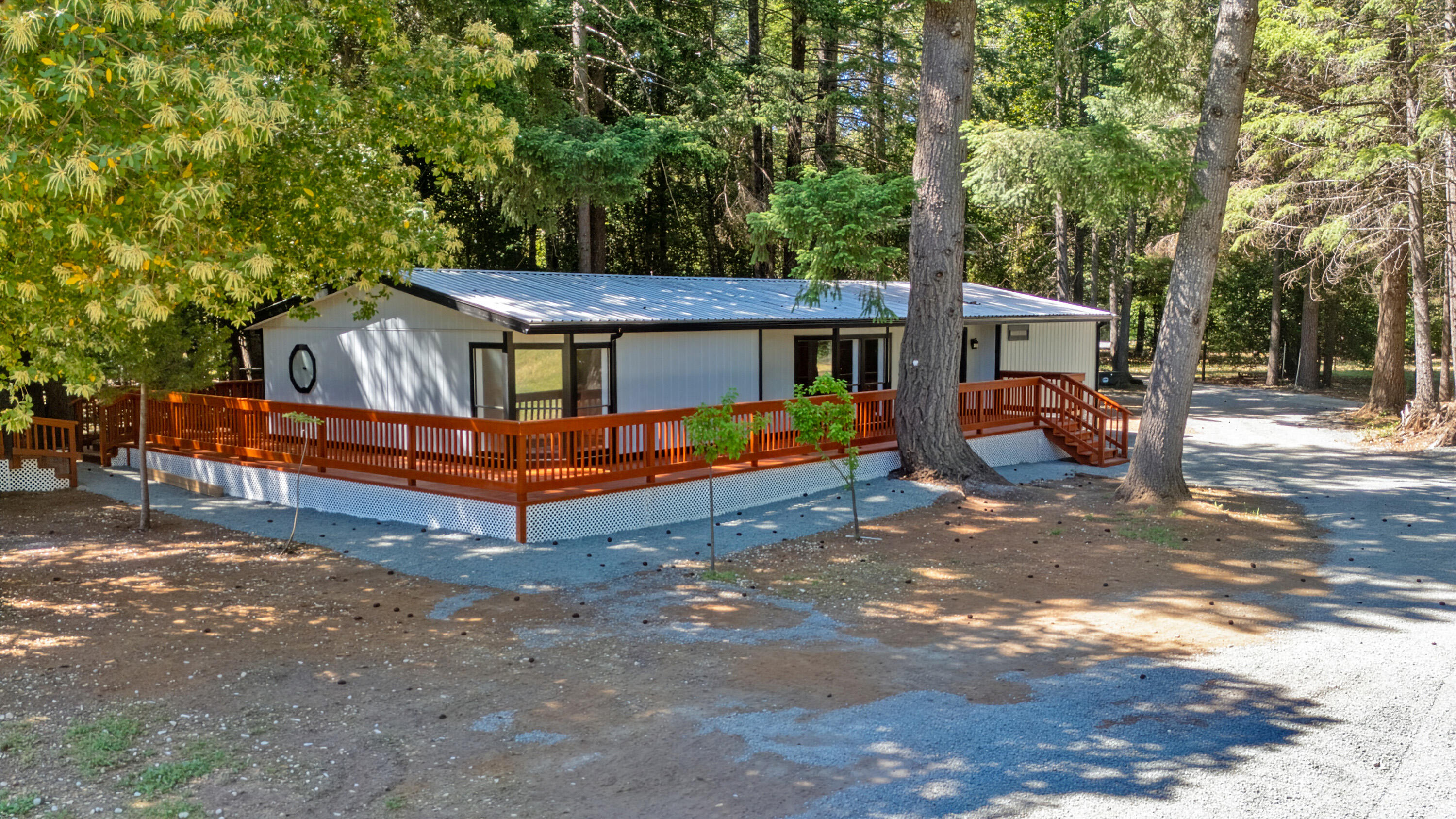 601 Pinewood Way Cave Junction, OR 97523 - Photo 30 of 33 a view of backyard with wooden fence and large trees