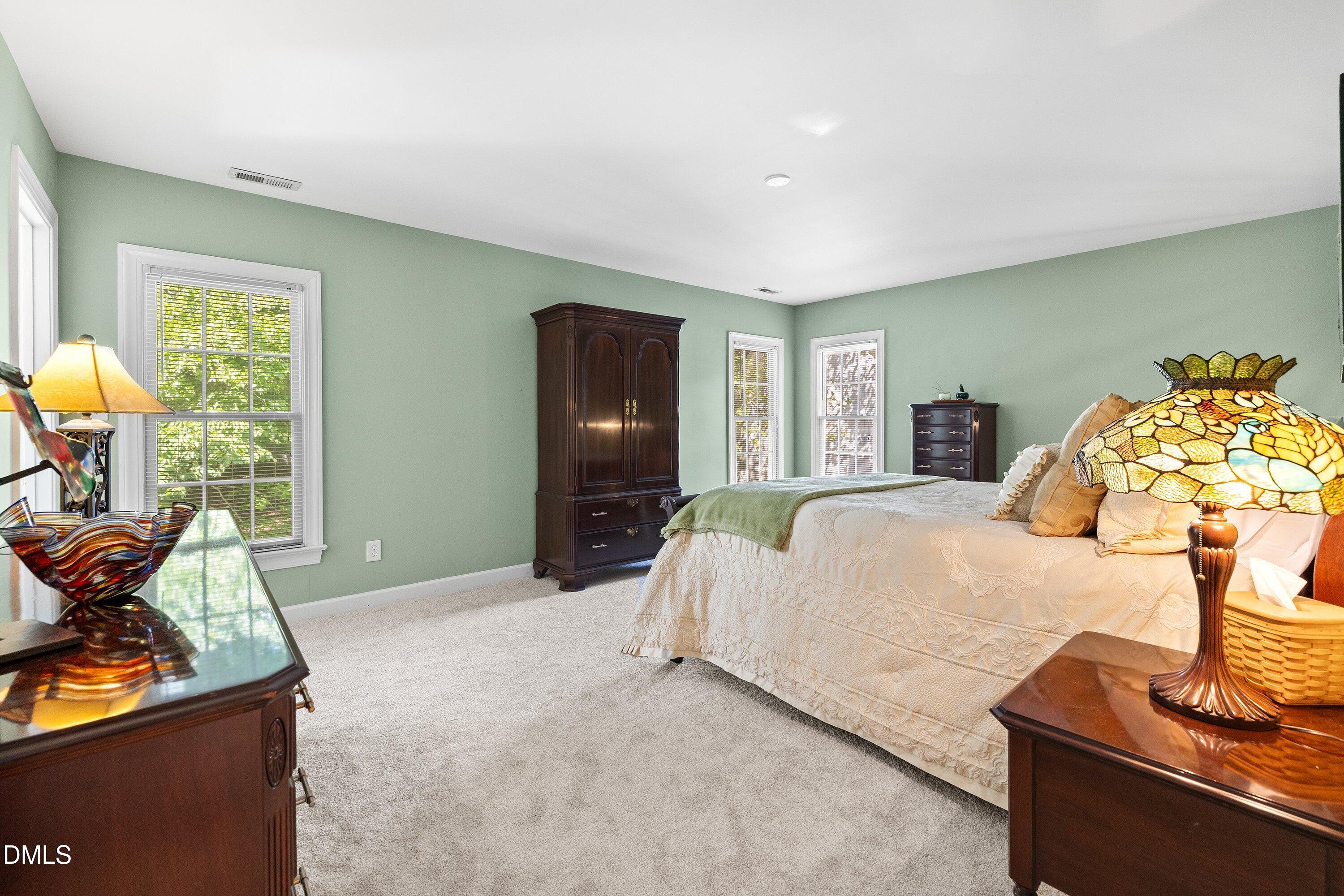 3914 Sterling Ridge Lane Durham, NC 27707 - Photo 31 of 66 Recessed lighting, light-toned carpeting, and multiple windows with white trim