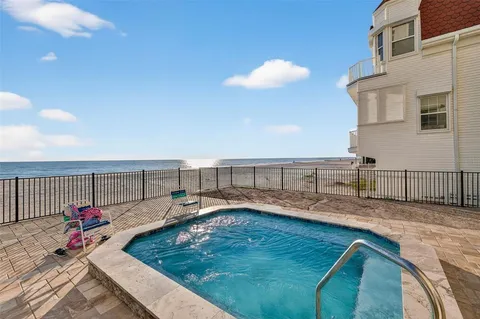 a view of a backyard with sitting area