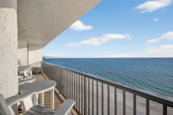 a balcony with view of nearby houses