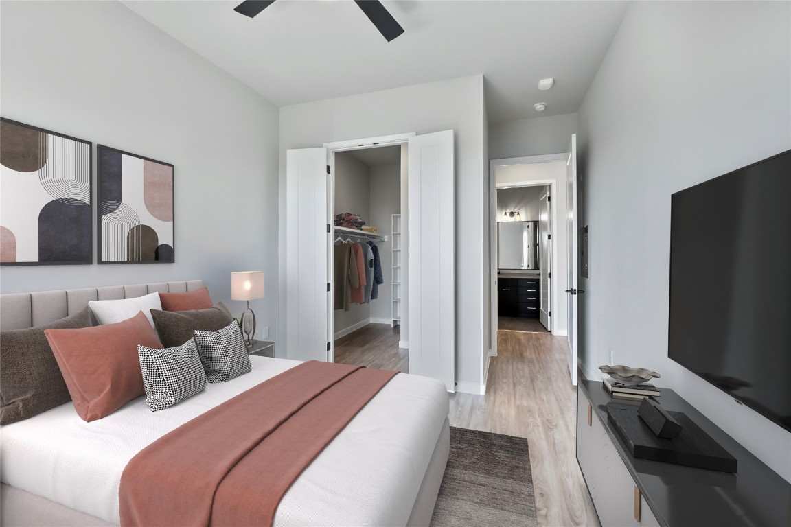 4510 Terry-O Lane, Unit 345 Austin, TX 78745 - Photo 11 of 15 a bedroom with a bed and a flat screen tv