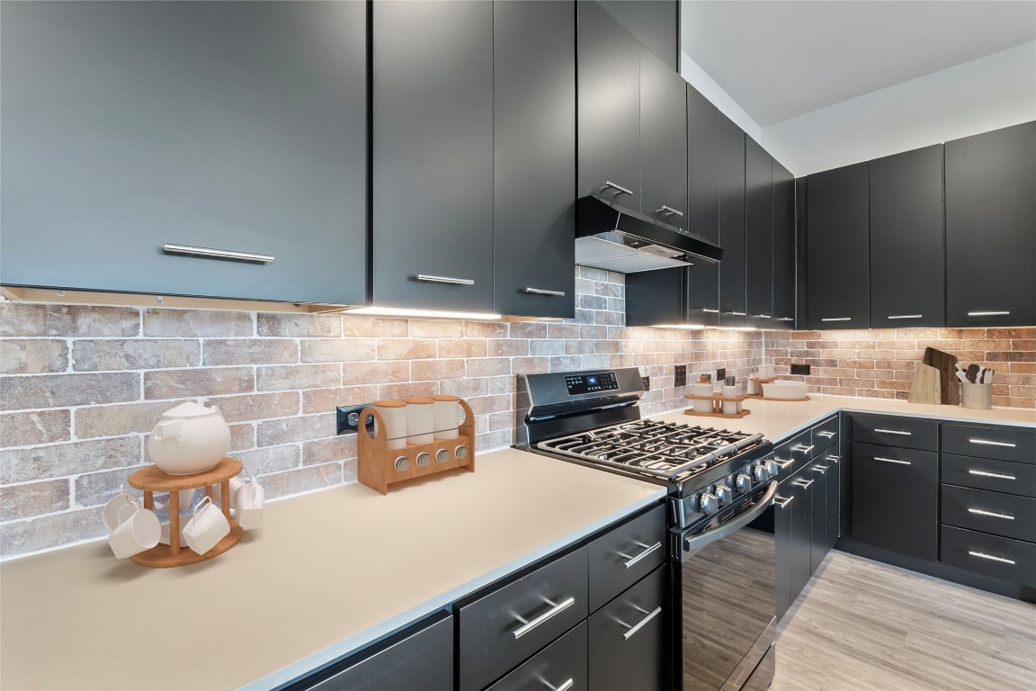 4510 Terry-O Lane, Unit 345 Austin, TX 78745 - Photo 3 of 15 a kitchen with a stove a sink and a refrigerator