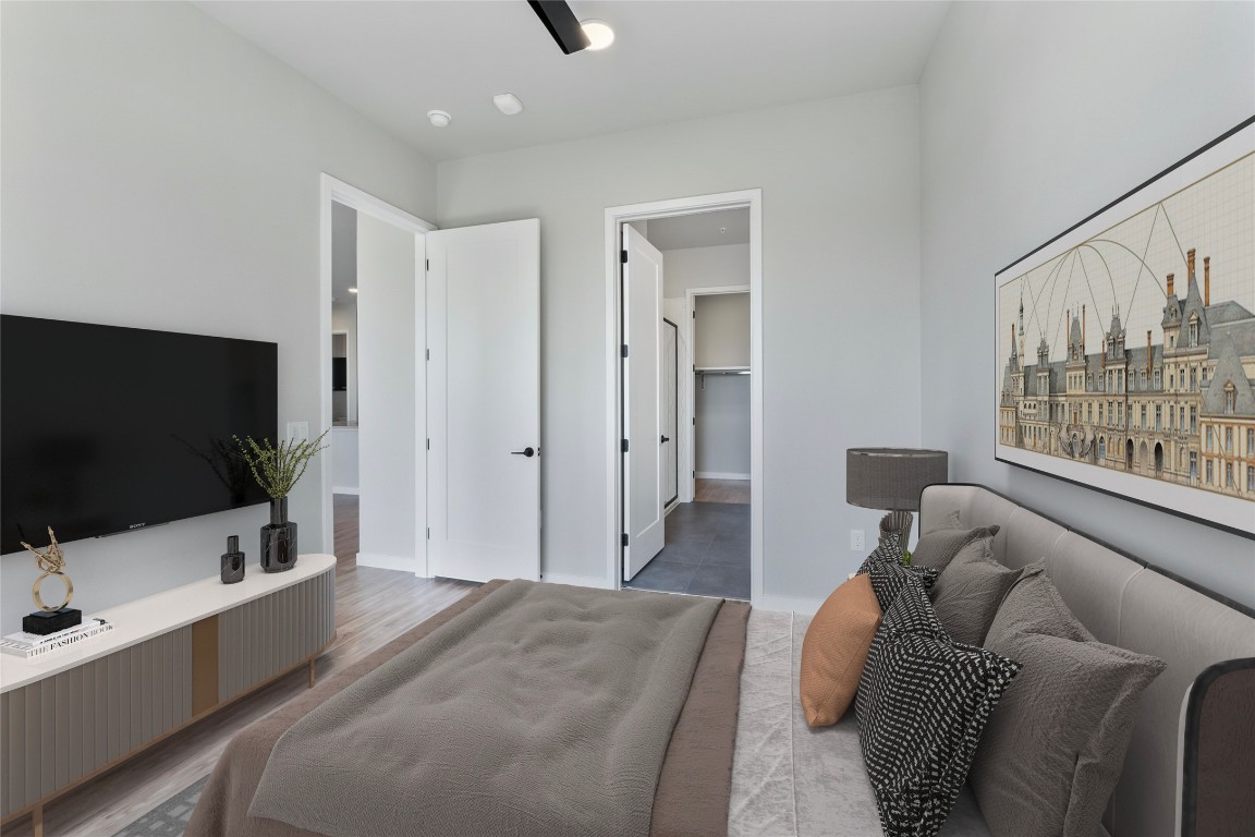 4510 Terry-O Lane, Unit 345 Austin, TX 78745 - Photo 6 of 15 a bedroom with furniture and a flat screen tv