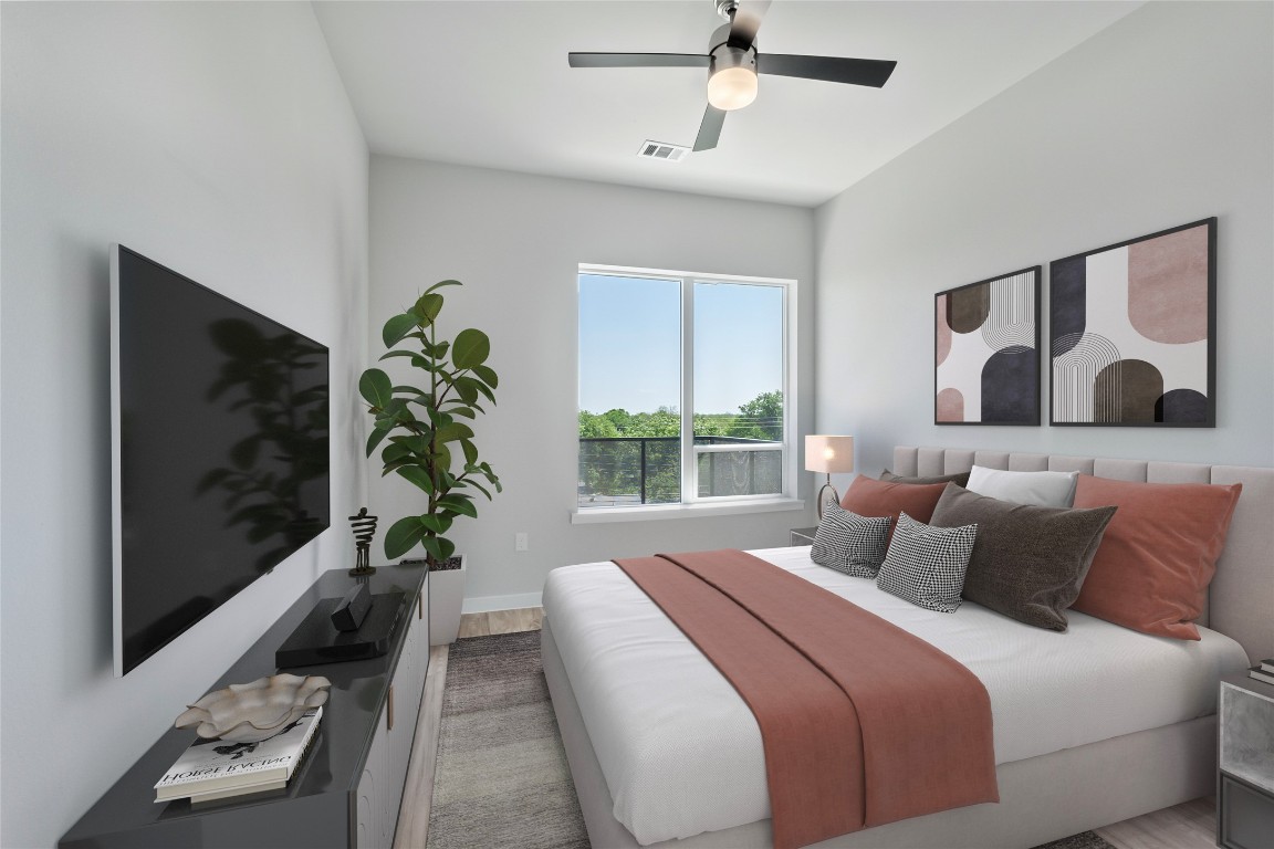 4510 Terry-O Lane, Unit 345 Austin, TX 78745 - Photo 10 of 15 a bedroom with a large bed and a potted plant