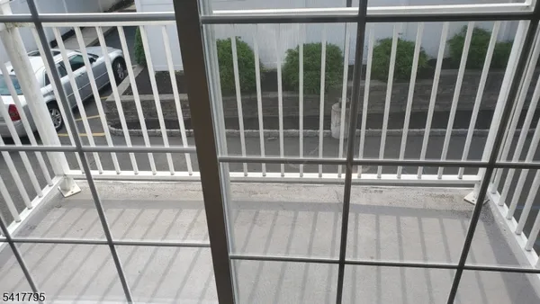 a view of staircase with railing and wooden floor