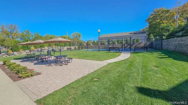 a view of a house with garden and a patio