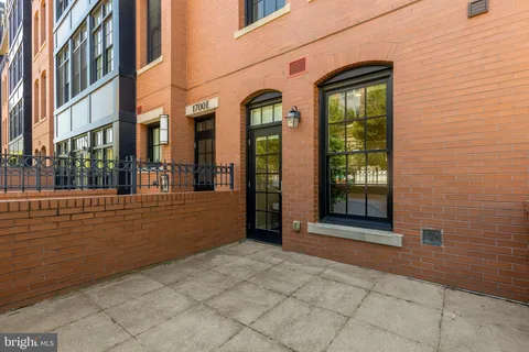 a view of a building with a brick wall