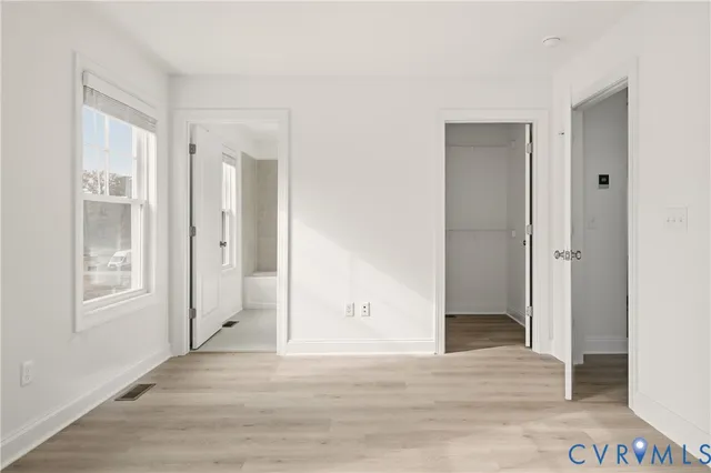 a view of entryway with wooden floor