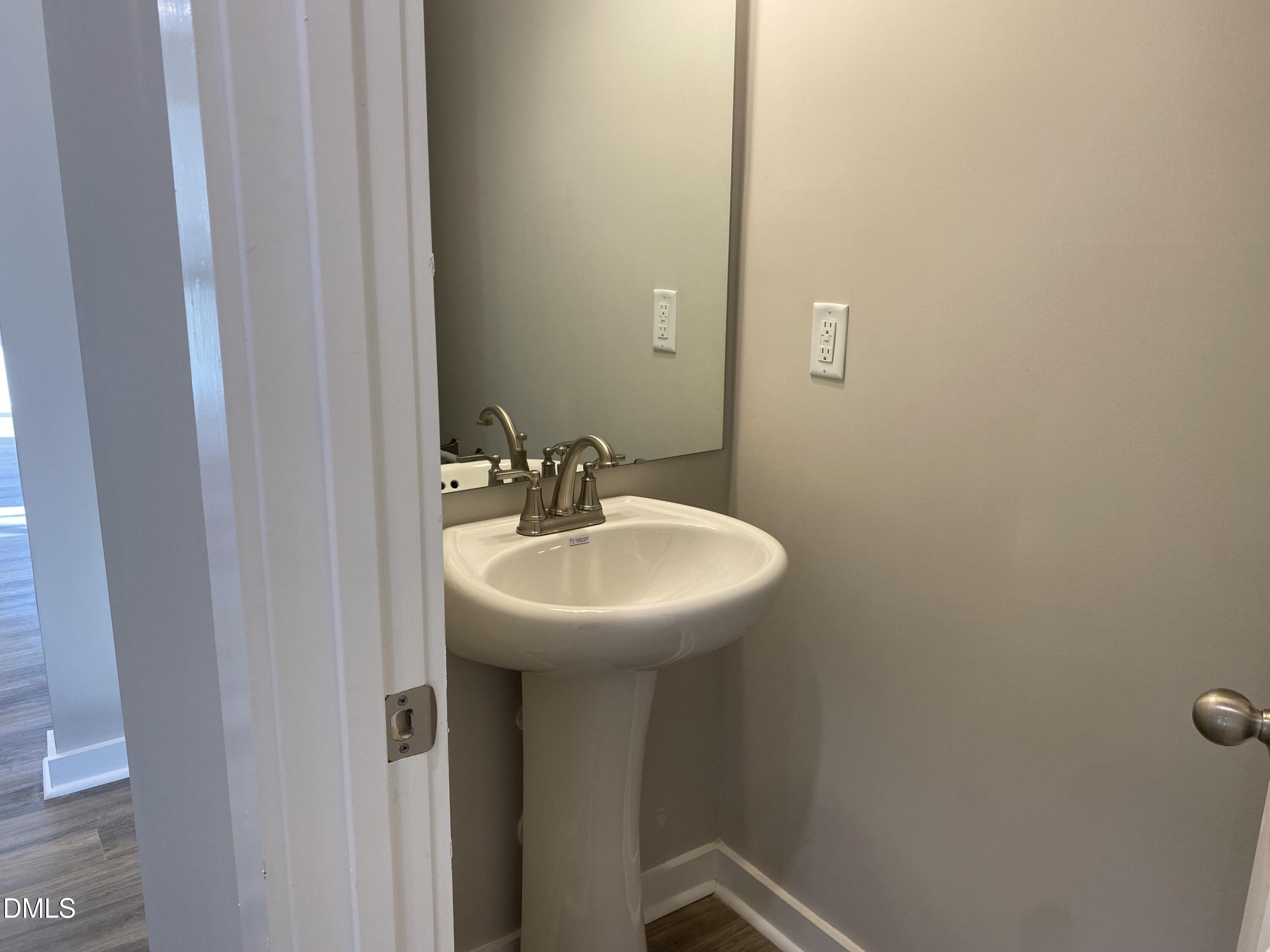 2827 Ricolden Trail Elon, NC 27244 - Photo 14 of 30 a bathroom with a sink and mirror