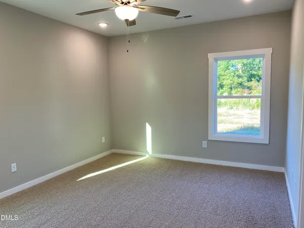 a view of a small space with wooden floor