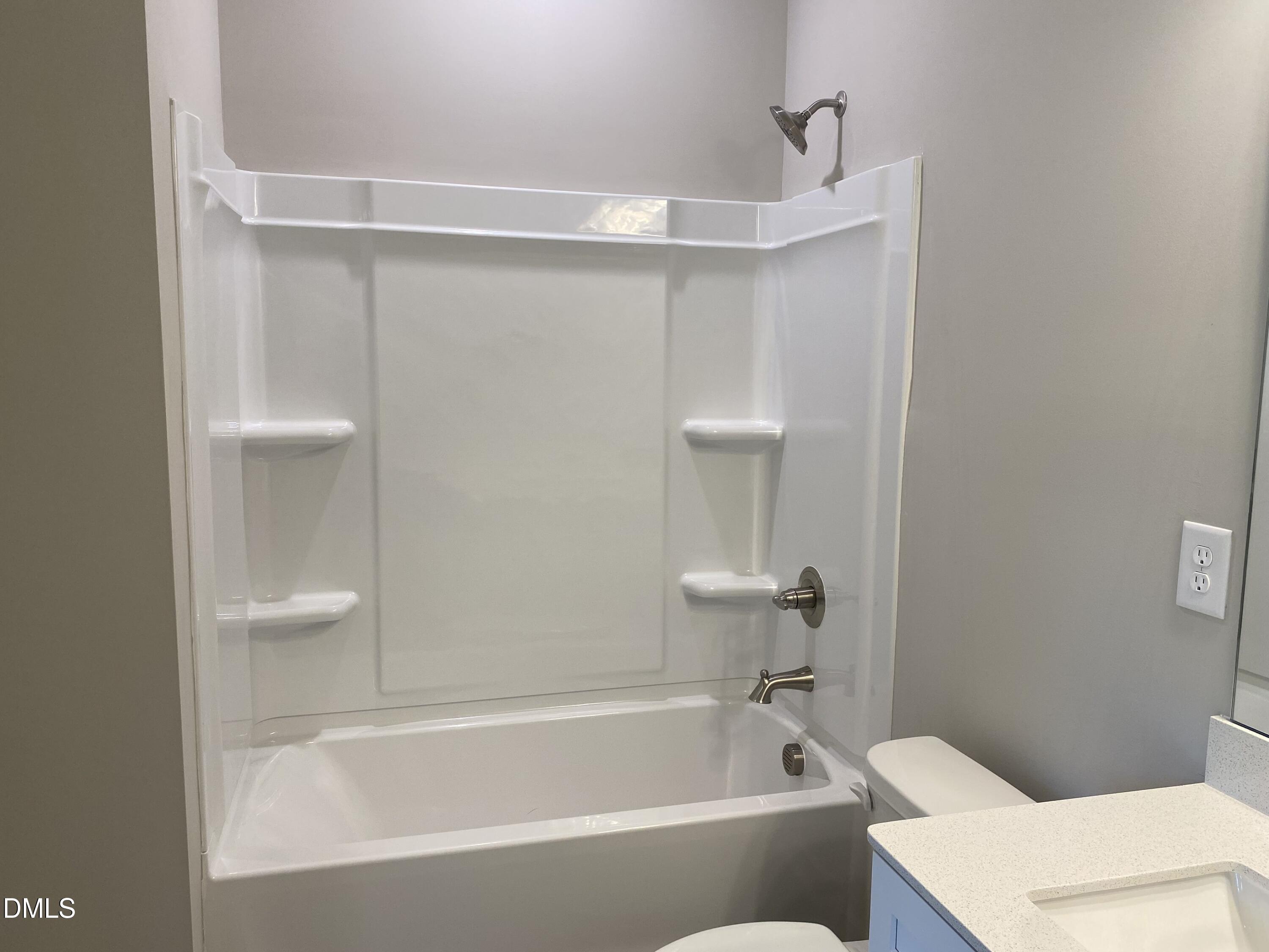 2827 Ricolden Trail Elon, NC 27244 - Photo 19 of 30 a bathroom with a bathtub and a shower