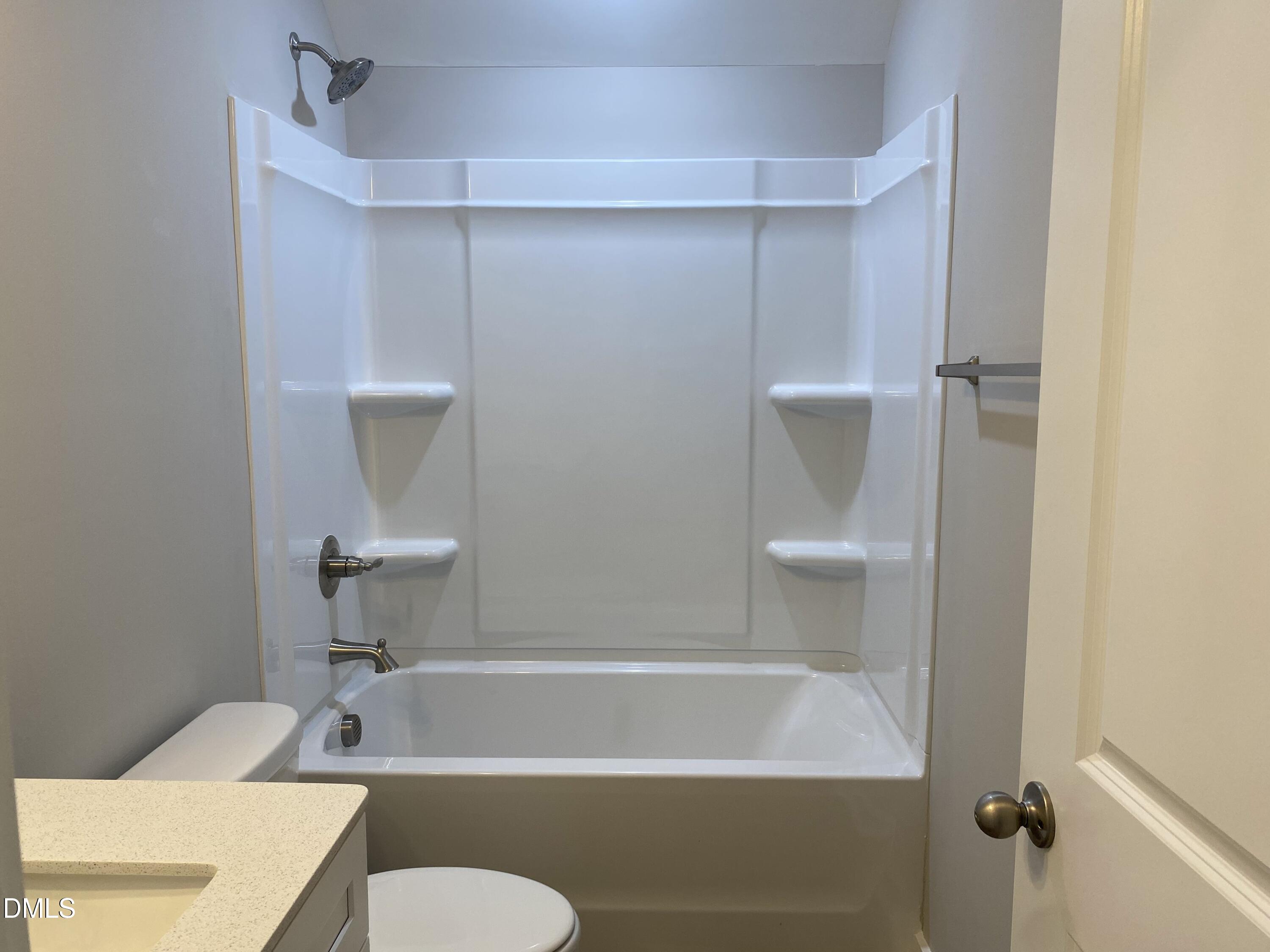 2827 Ricolden Trail Elon, NC 27244 - Photo 25 of 30 a bathroom with a sink a toilet and tub