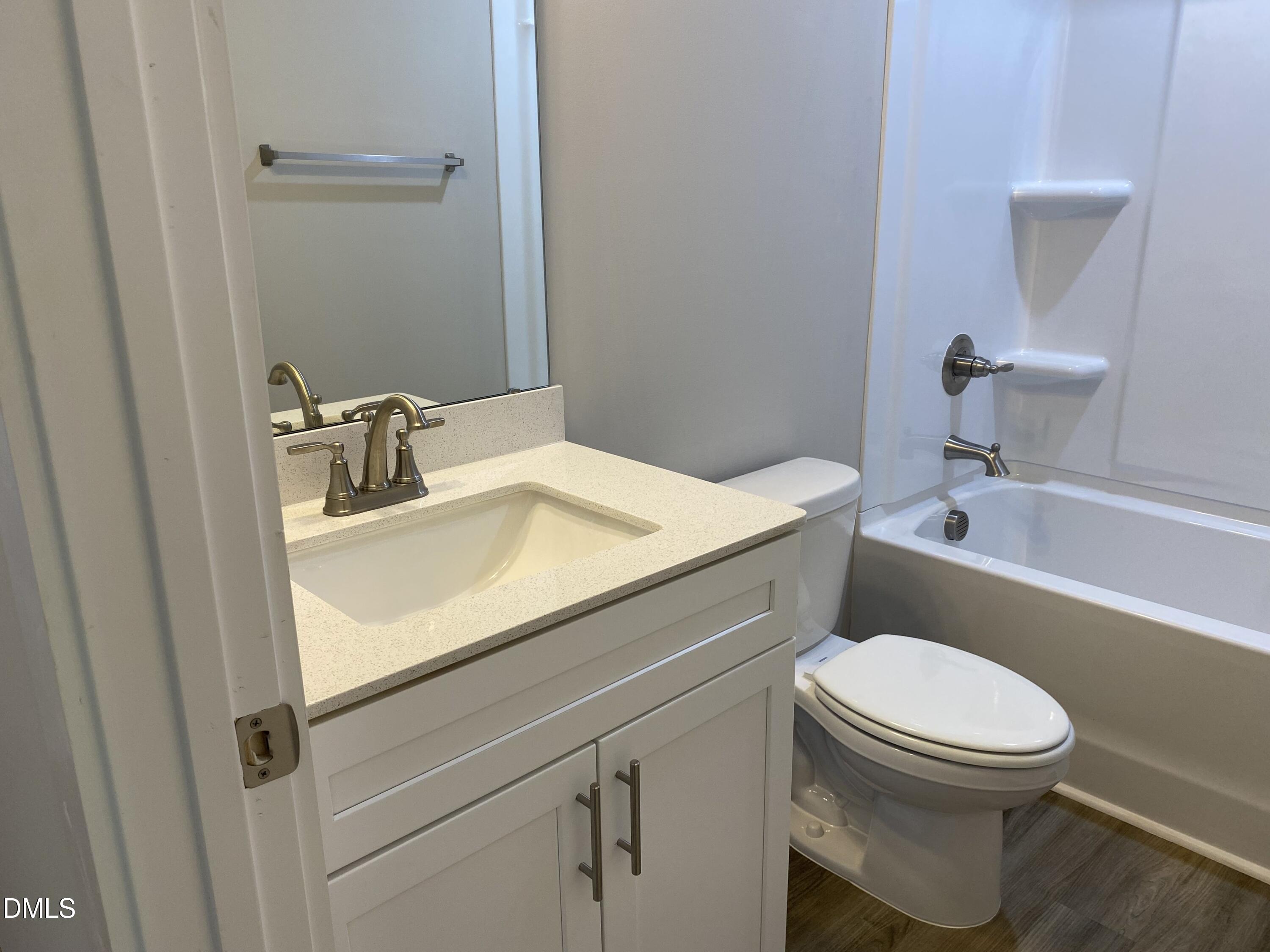 2827 Ricolden Trail Elon, NC 27244 - Photo 26 of 30 a bathroom with a sink a toilet and shower