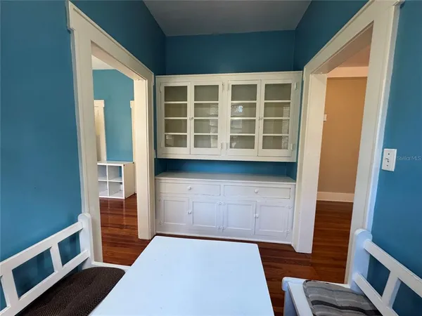 wooden floor in an empty room and a window
