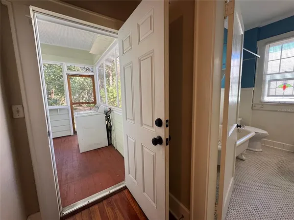a view of a bathroom from a hallway