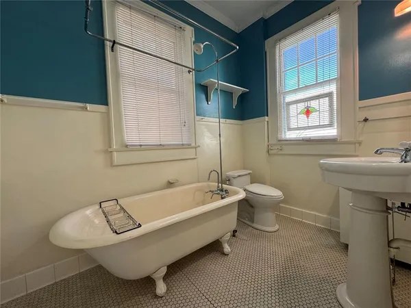a bathroom with a sink a toilet and a bathtub