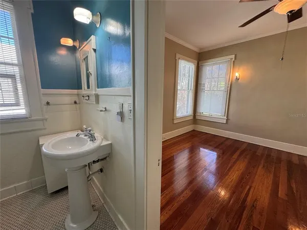 a bathroom with a sink and a mirror