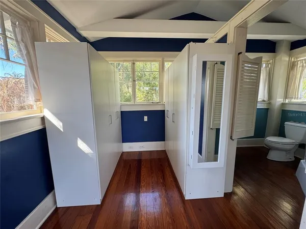 a view of entryway with wooden floor and window
