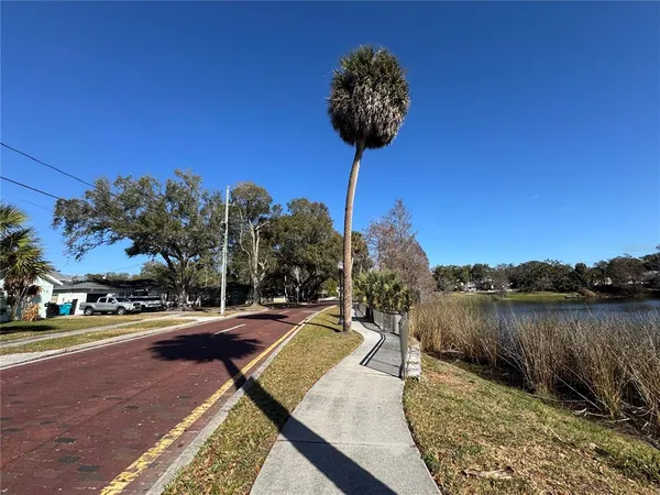 a view of a lake with a table and chairs