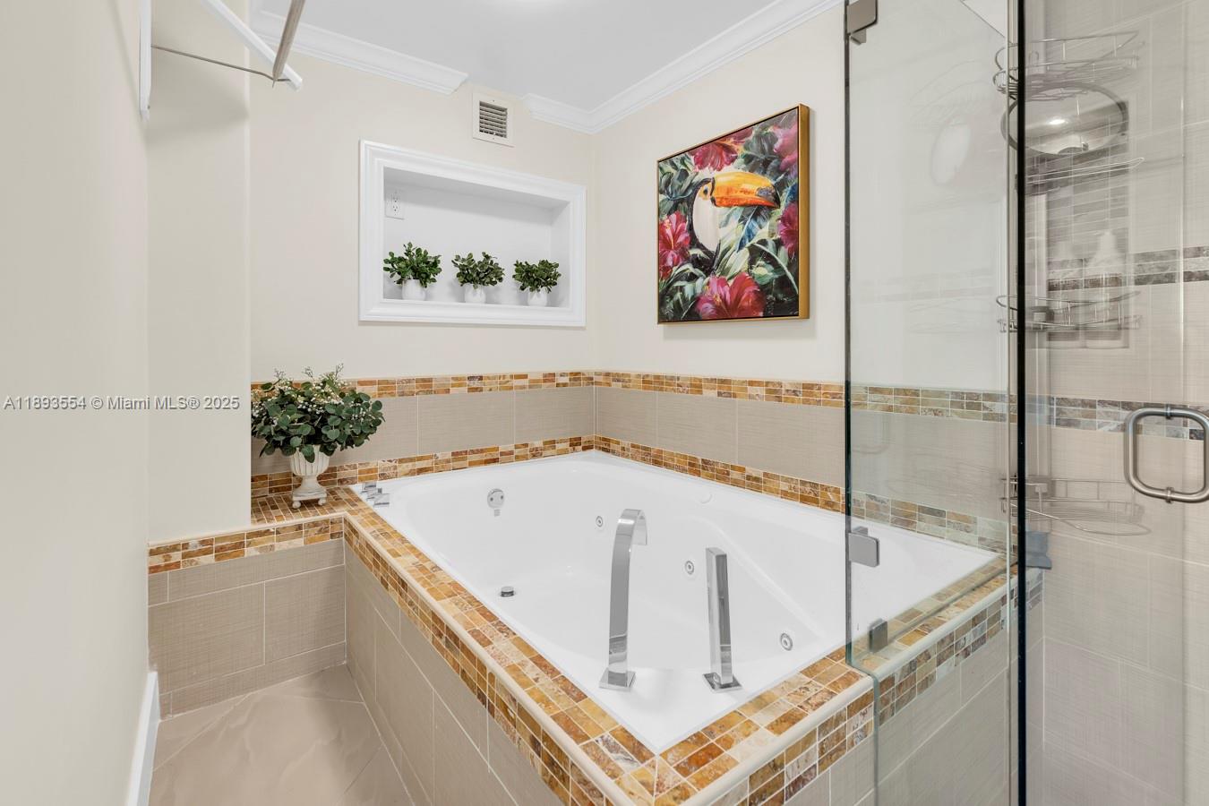 7135 Collins Avenue, Unit 1126 Miami Beach, FL 33141 - Photo 23 of 45 a bathroom with a tub and sink