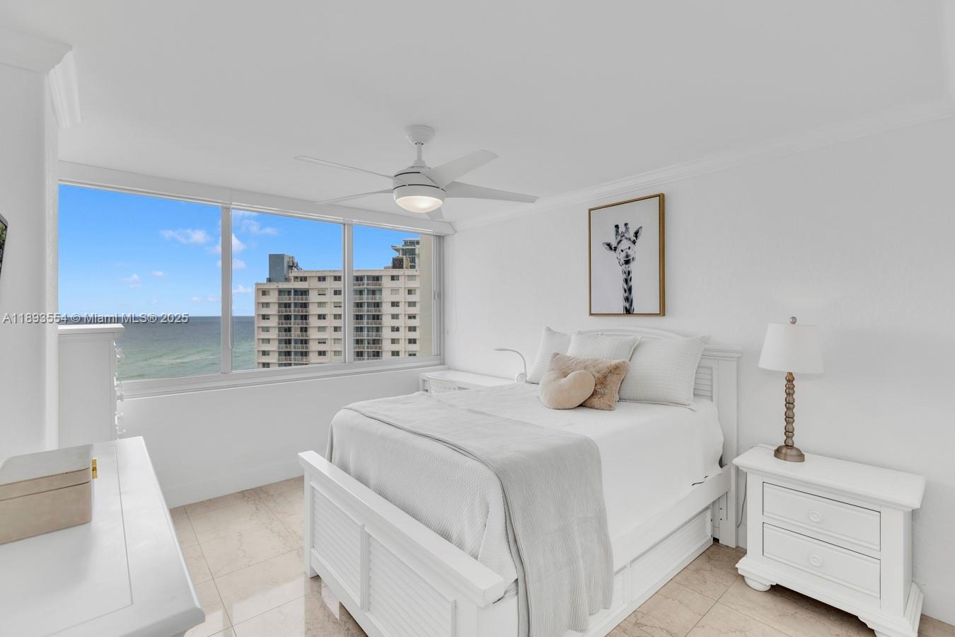 7135 Collins Avenue, Unit 1126 Miami Beach, FL 33141 - Photo 24 of 45 a bedroom with a bed and a window