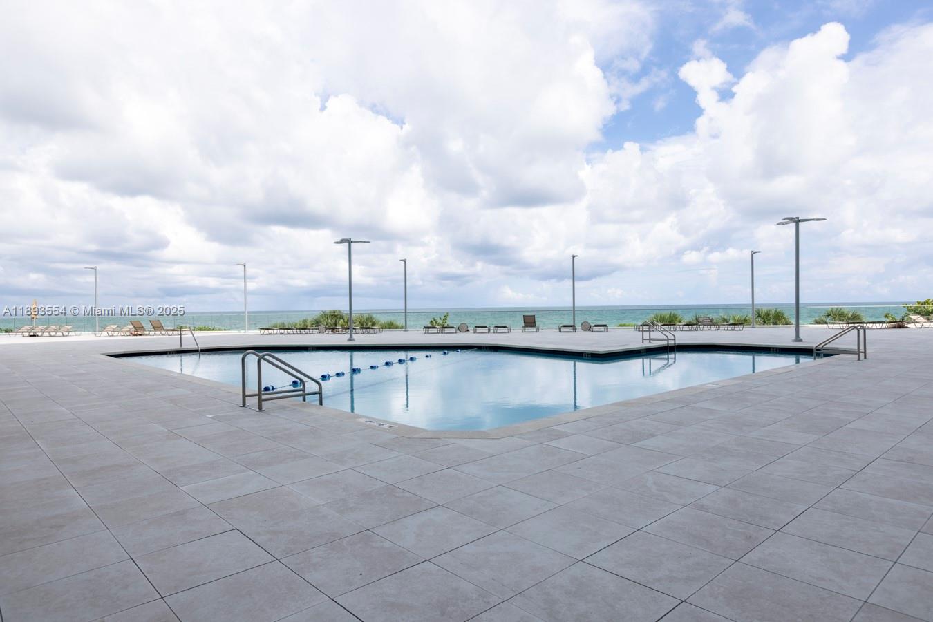 7135 Collins Avenue, Unit 1126 Miami Beach, FL 33141 - Photo 29 of 45 a view of a lake with a terrace