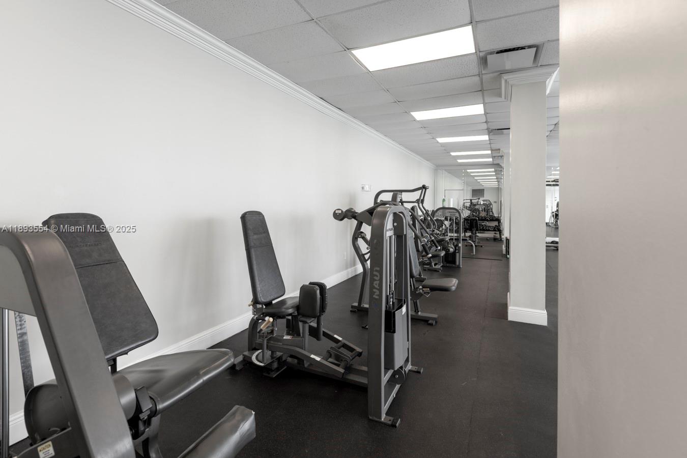 7135 Collins Avenue, Unit 1126 Miami Beach, FL 33141 - Photo 30 of 45 a view of a room with gym equipment