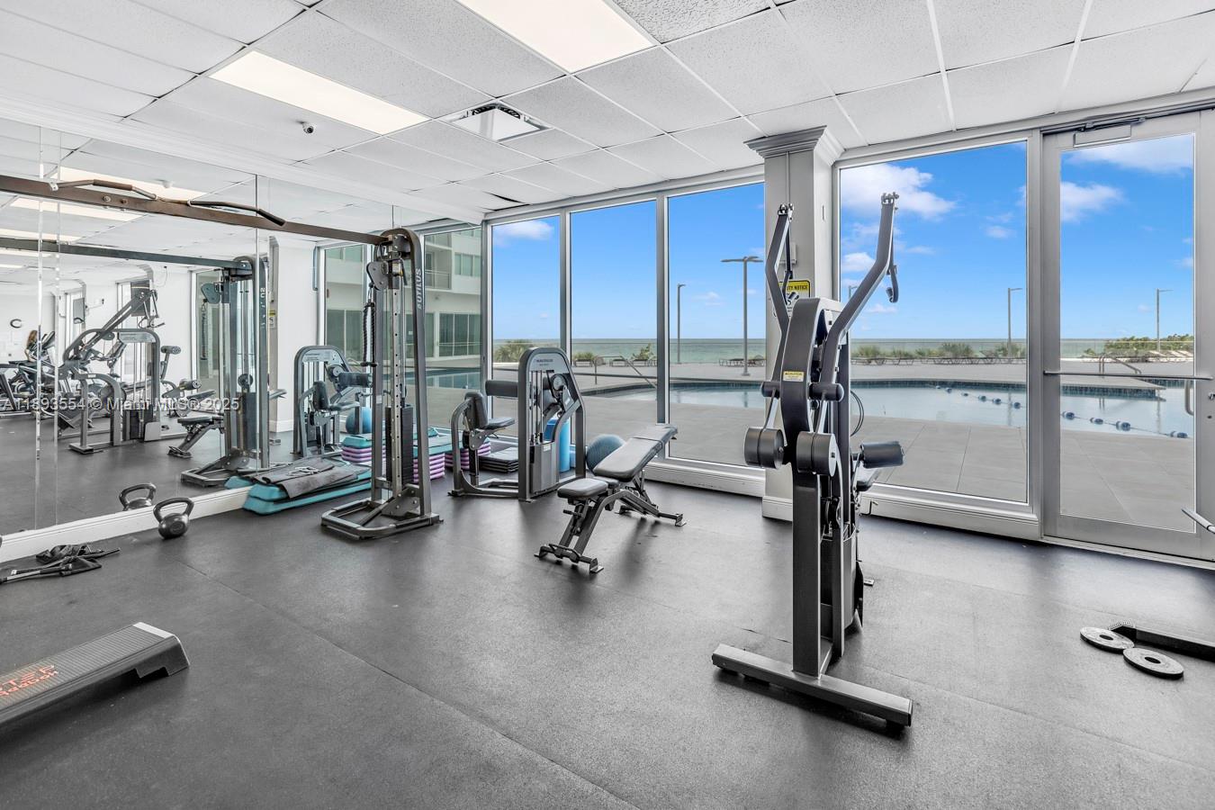 7135 Collins Avenue, Unit 1126 Miami Beach, FL 33141 - Photo 32 of 45 a view of a room with gym equipment