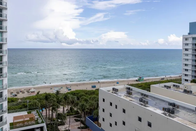 a view of a city with an ocean view