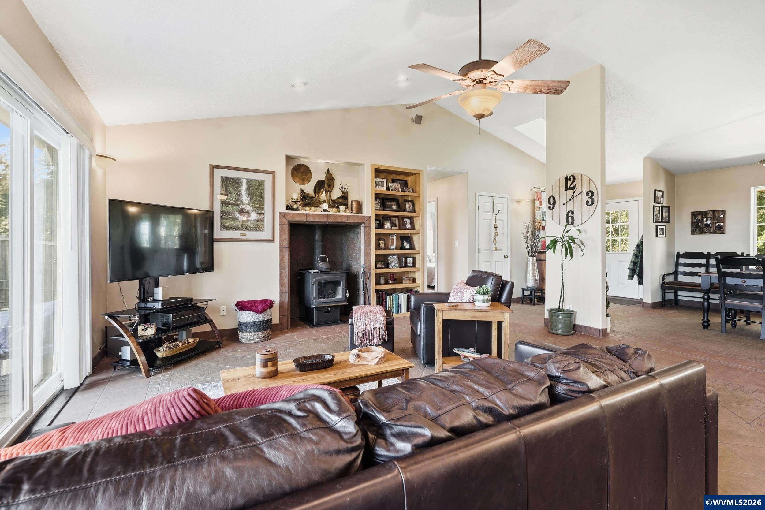 1110 Reuben Boise Road Dallas, OR 97338 - Photo 6 of 49 a living room with furniture chandelier and a flat screen tv