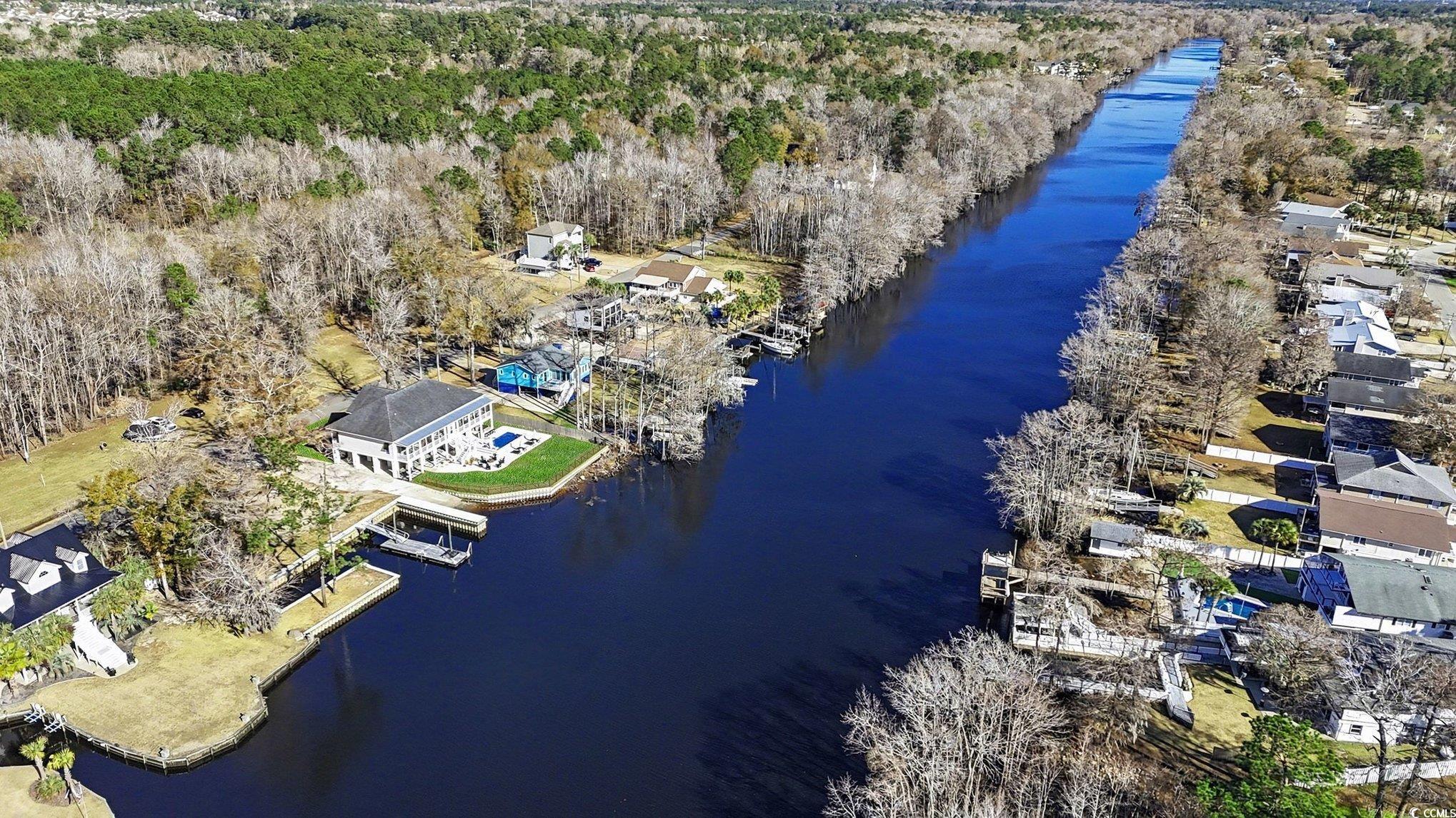 3741 Ed Smith Avenue Myrtle Beach, SC 29588 - Photo 5 of 38 Bird's eye view of a large body of water and a heavily wooded area
