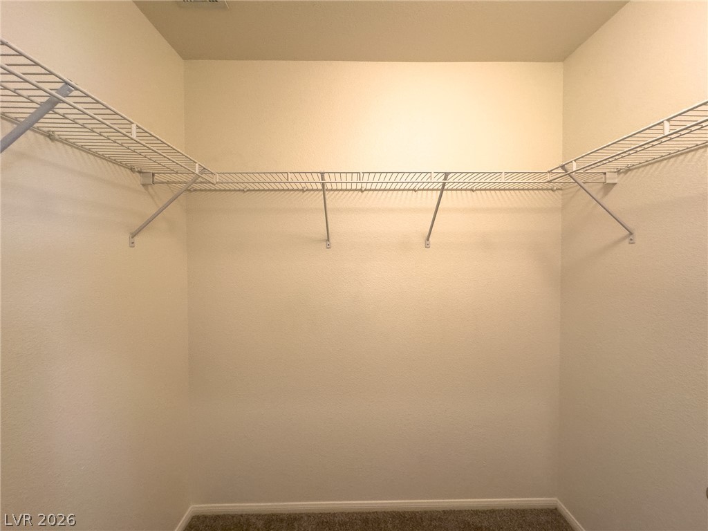 9456 Grandview Spring Avenue Las Vegas, NV 89166 - Photo 26 of 49 Ample wire shelving provides practical, organized storage for personal items.