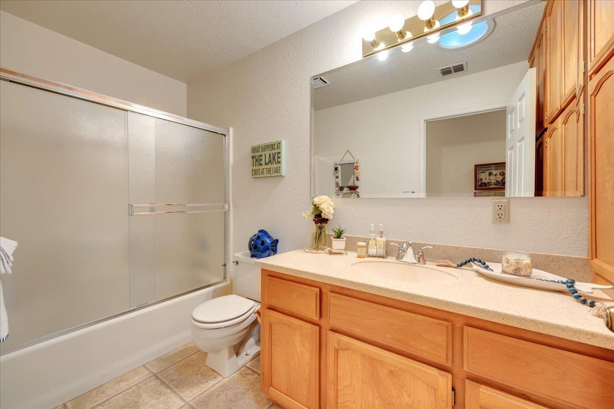342 Poker Flat Road, Unit 239 Copperopolis, CA 95228 - Photo 32 of 72 Full guest bath with Corian stone countertop, large tub and shower stall plus tons of storage and a solar tube for great natural light.