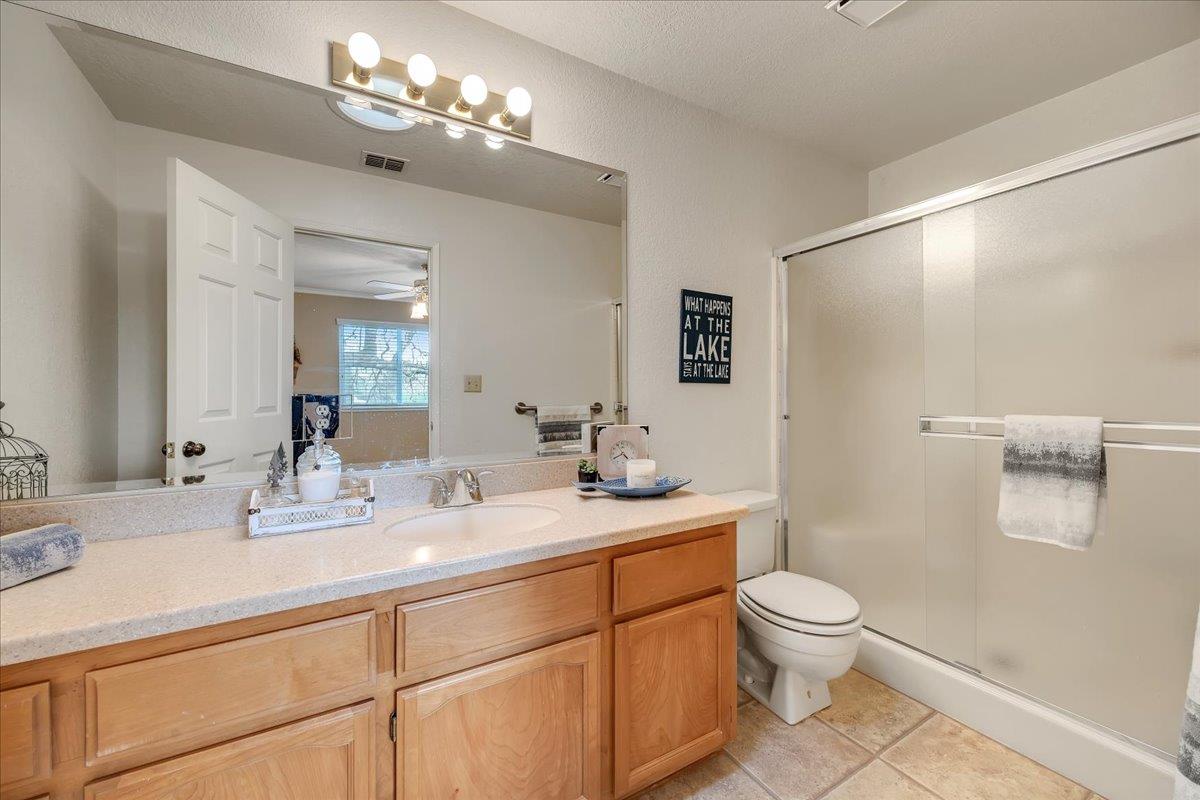 342 Poker Flat Road, Unit 239 Copperopolis, CA 95228 - Photo 41 of 72 Spacious Corian counter, large shower stall and solar tube for great natural light.