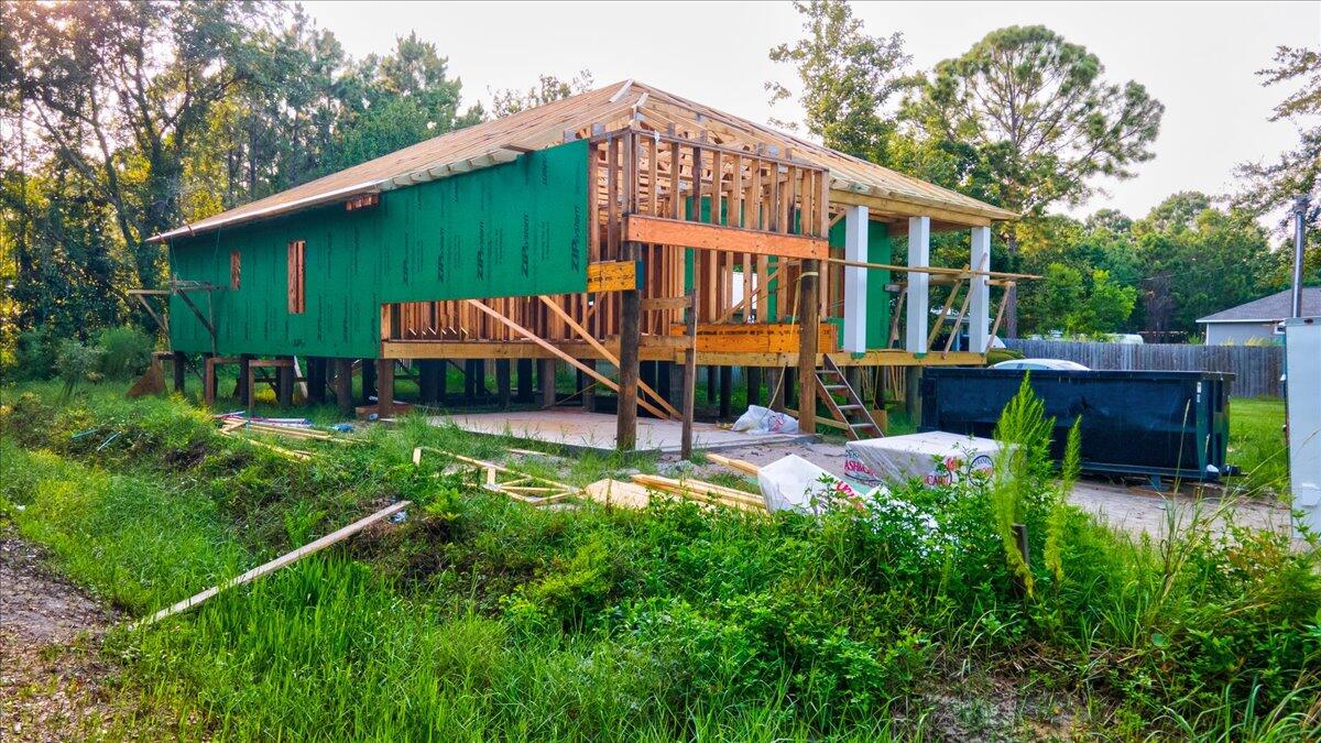 120 6th Street Santa Rosa Beach, FL 32459 - Photo 5 of 13 a view of a house with backyard and sitting area