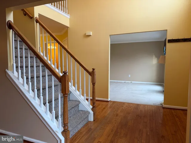a view of an entryway with wooden floor