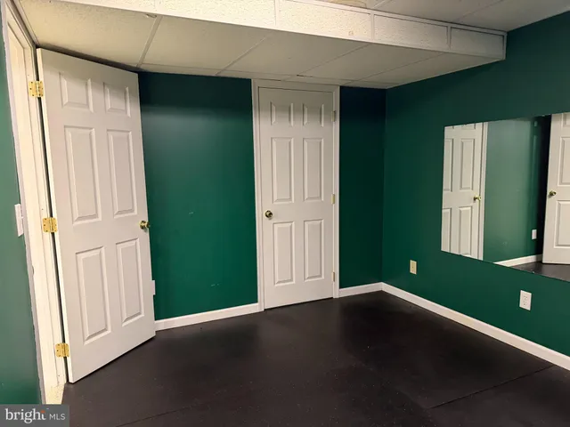 a backyard of a house with outdoor seating