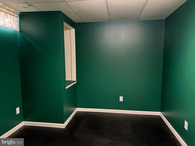 a view of a roof deck with wooden fence and floor