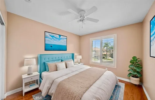 a bedroom with a large bed and a window