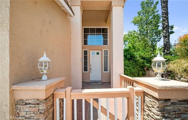 a view of an entryway with wooden floor and door