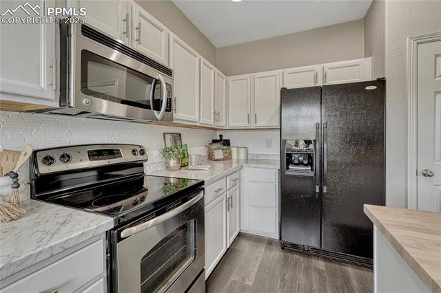 2215 Reed Grass Way Colorado Springs, CO 80915 - Photo 16 of 50 So much storage including a pantry!