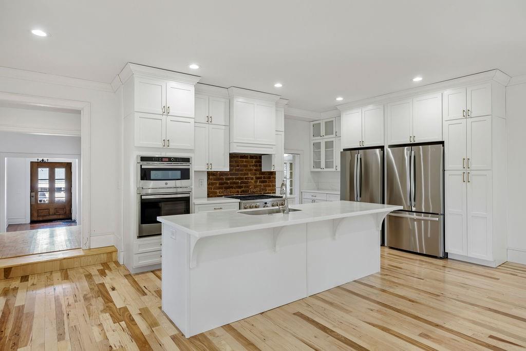 312 East 3rd Street Rome, GA 30161 - Photo 20 of 42 a kitchen with stainless steel appliances a stove top oven a refrigerator and a center island