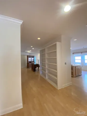 a view of a livingroom with furniture and a ceiling fan