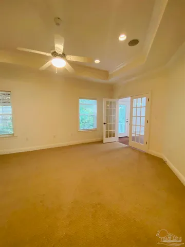 an empty room with a empty space and windows