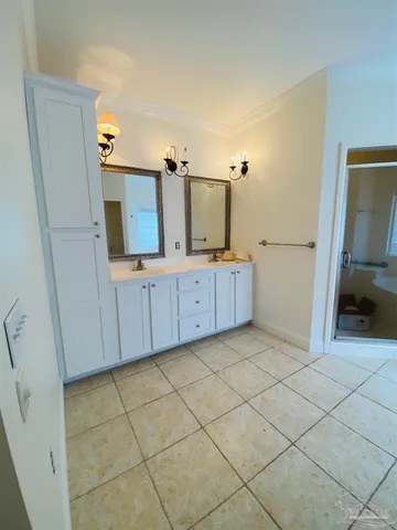 an empty room with a empty space and windows