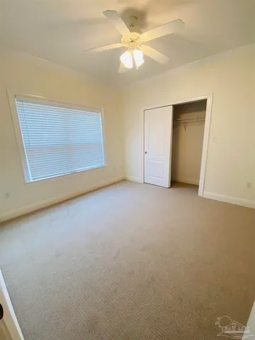 a view of a room with shelves and wooden shelves
