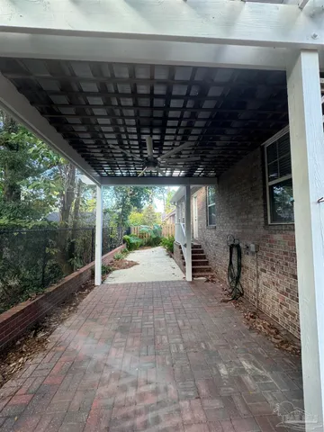 a view of a backyard with sitting area