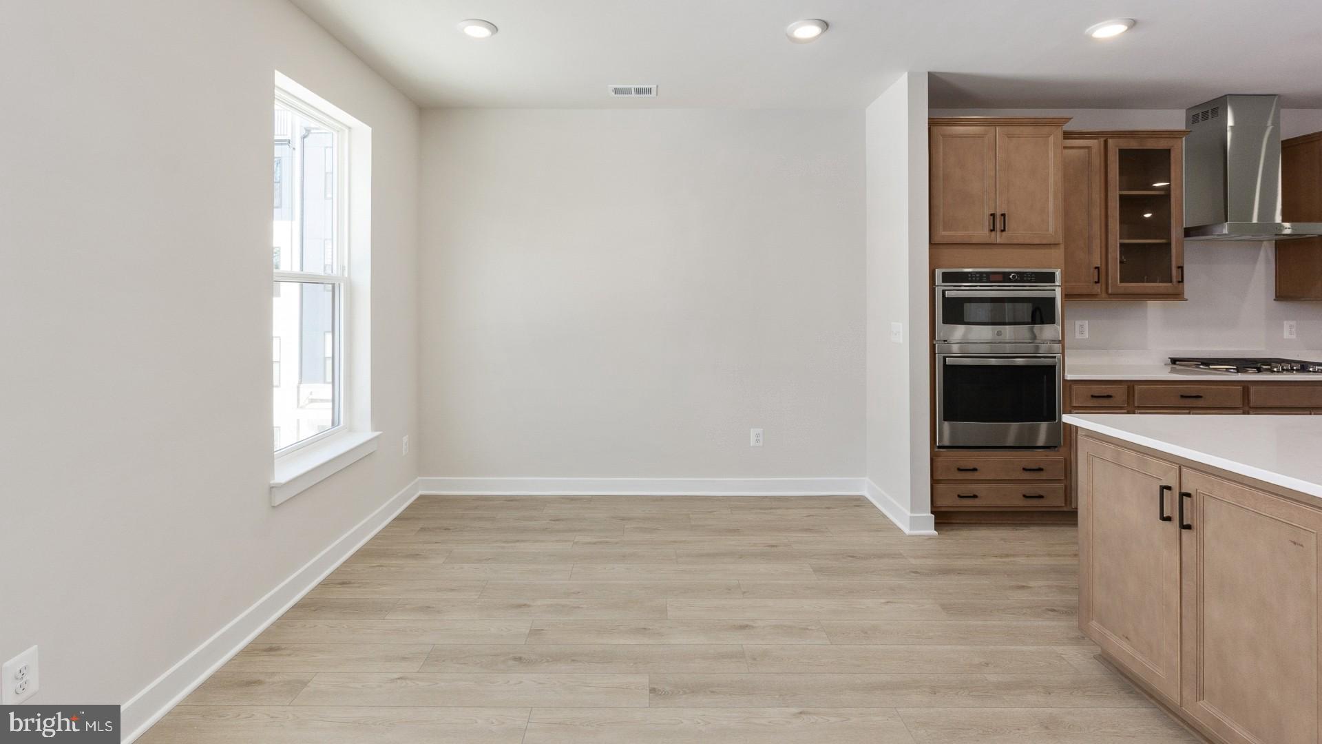 20821 Cloongee Terrace Sterling, VA 20166 - Photo 12 of 34 a view of cabinets and wooden floor